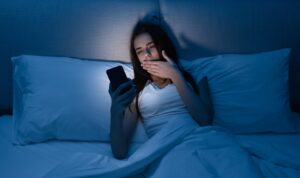 Local woman commits to going to bed at a reasonable time, then scrolling until an unreasonable time